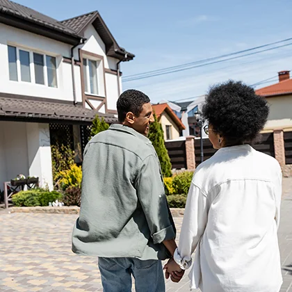 People walking into their new Phoenix home.